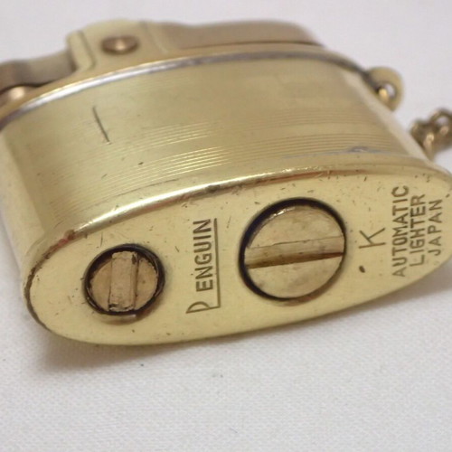 Vintage Penguin K Automatic Lighter made of brass, like new
