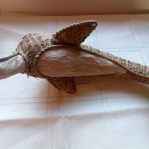 Handmade decorative dolphin made of grass