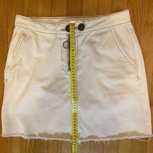 Pink Woman mini denim skirt with ripped hem like new, size 38