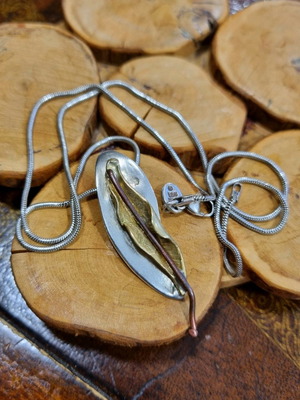 Silver handmade jewelry used with mixed materials leaf design