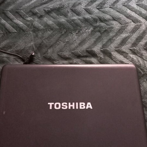Toshiba Satellite C660D-10D laptop used with charger and accessories