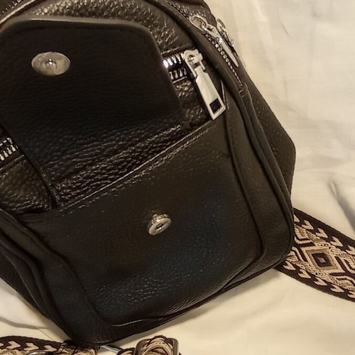 Black Sling Bag Crossbody backpack like new with wide strap and multiple pockets