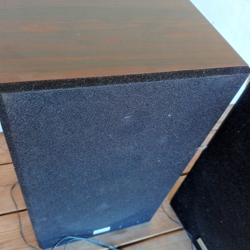 Floor-standing speakers used with wooden frame