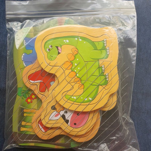 Puzzle like new, set of 4 with animals, dinosaur, cow and airplane