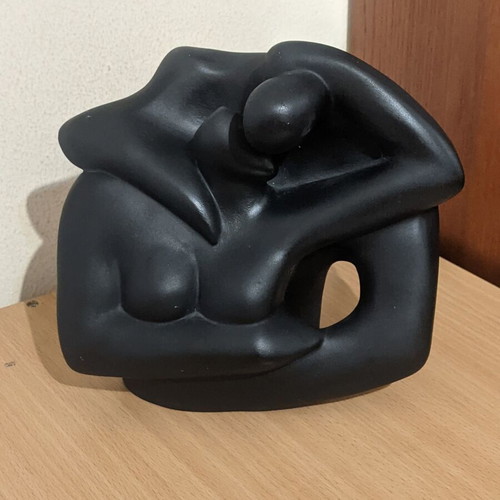 Ceramic sculpture of embracing woman and man