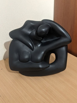 Ceramic sculpture of embracing woman and man