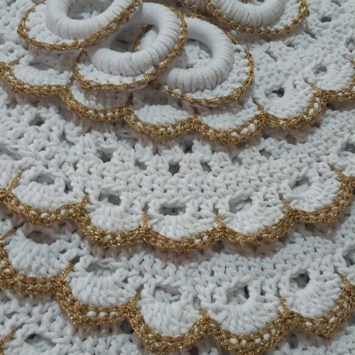 Elegant handmade white table set with gold details and napkin rings