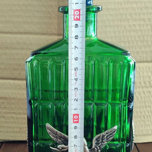 Vintage Italian glass bottle in metal base like new