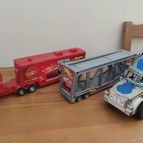 Toy Trucks pack of 3 used, including Cars-themed red truck