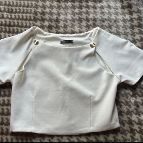 White top like new with cutouts and gold buttons size M