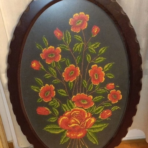 Oval embroidered painting with flowers used