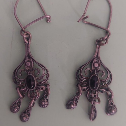 Silver earrings used, medium length with black stone