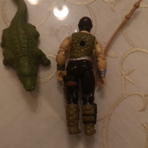 G.I. Joe action figure with alligator, whip and animal muzzle