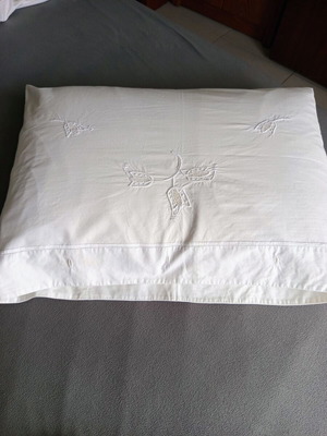 Vintage white cotton pillowcases pair with embroidery used