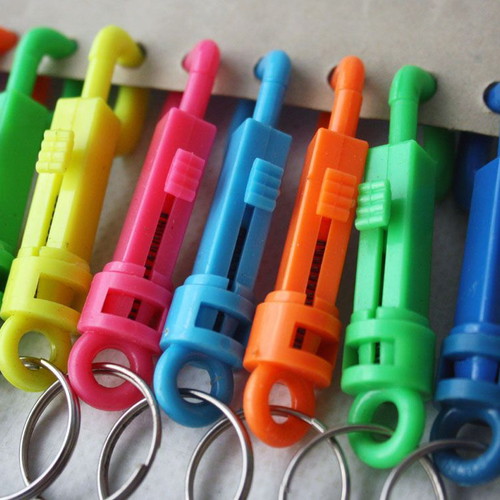 Card with 12 vintage 1980s phosphorescent key chains, new