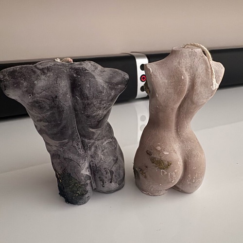 Set of soy candles shaped as female and male bodies like new