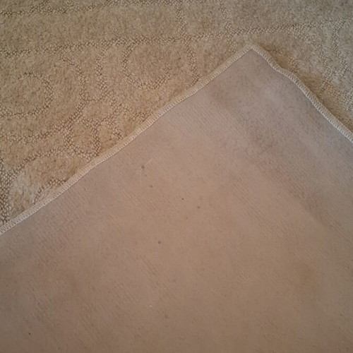 Beige rug large 1.98 × 2.90 with embossed design, used