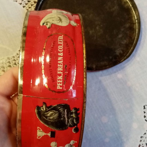 Vintage tin box used with floral and dog motifs