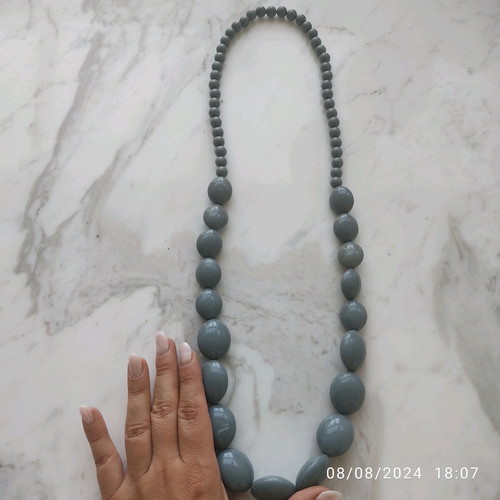 Long necklace with gray celluloid beads used