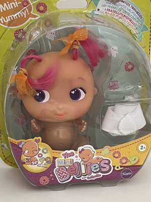The Bellies Mini Yummy doll used, pink hair, orange bows