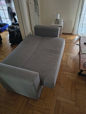 Two-seater sofa with storage and bed function