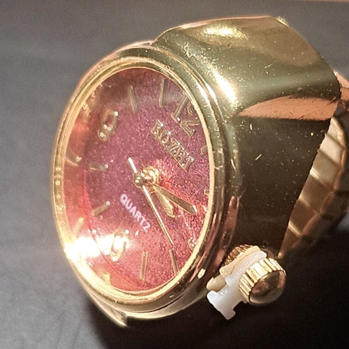 Quartz ring watch like new with purple dial and gold bracelet