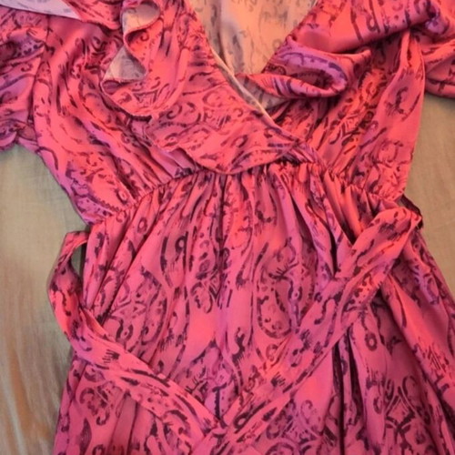 Wrap dress in bright fuchsia with ruffle sleeves