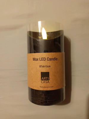 Decorative plastic candle new, black, battery operated