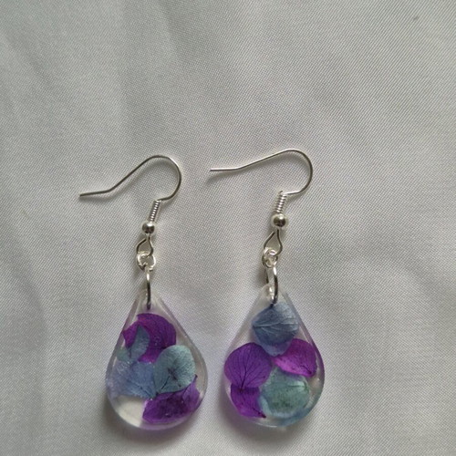 Liquid glass earrings new with purple and turquoise dried flowers