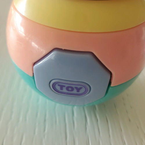 Baby toys ball and horn like new in pastel colors