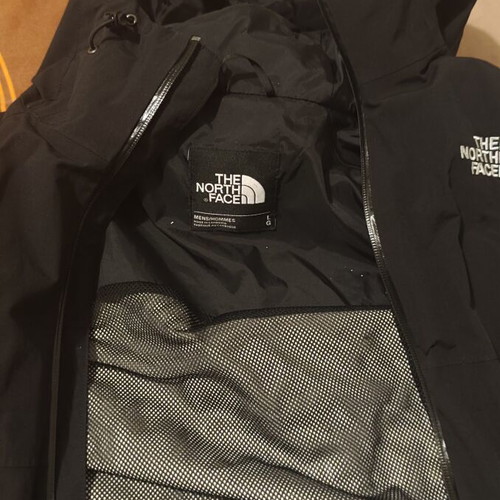 The North Face waterproof windbreaker jacket used, size large, black