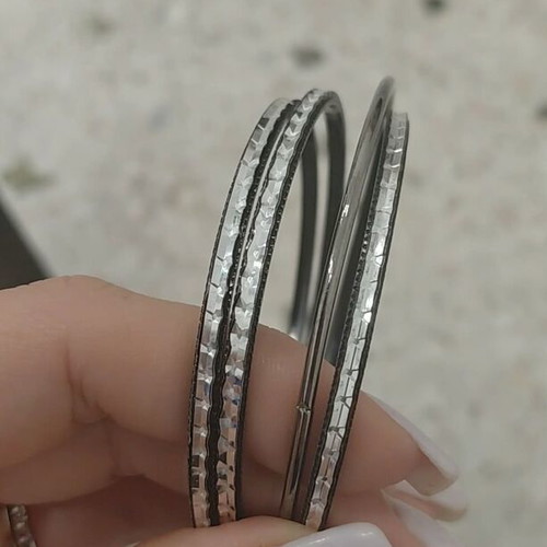 Bracelets set of 4 in black and silver color like new