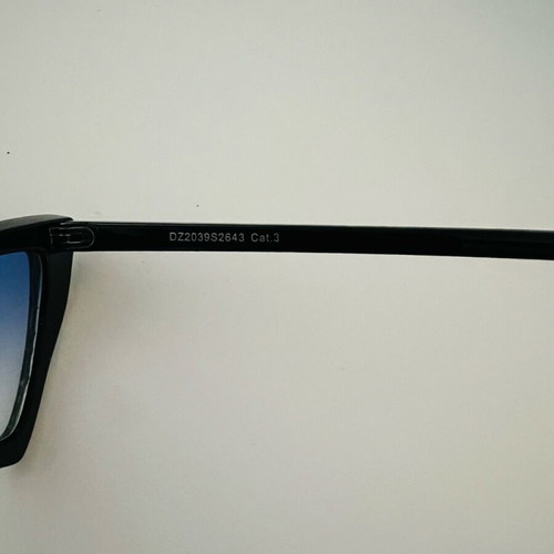 Glasses with blue triangular lens used, black frame