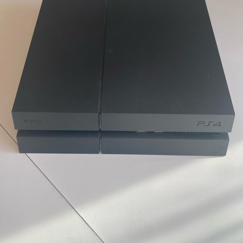 PlayStation 4 Fat 500GB console used with DualShock 4 controller