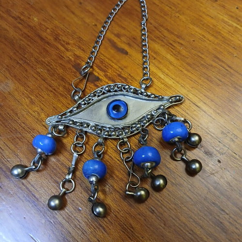 Vintage metal evil eye decoration used, silver with blue beads