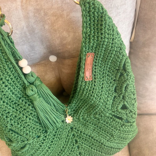 Handmade green shoulder bag with gold chain and decorative tassels