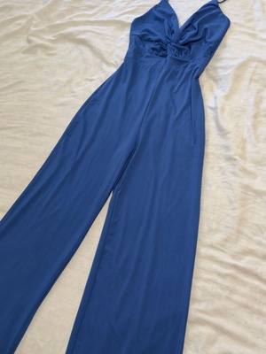 Blue jumpsuit used with thin straps and V neckline