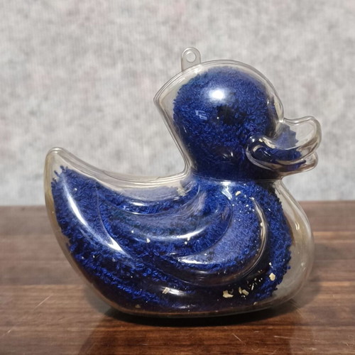 Decorative plastic duck like new with towel and small soap