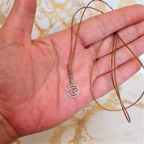 Men's pendant with Cancer zodiac and brown snake cord, new
