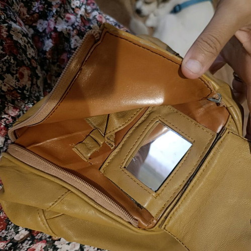 Leather backpack beige like new with multiple pockets and zippers