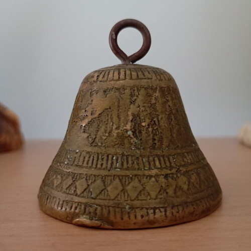 Vintage brass bell with embossed geometric designs like new