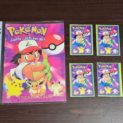 Pokemon album new with four sealed packs