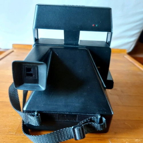 Polaroid Supercolor 635CL vintage instant camera used with strap