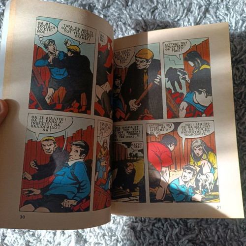 Mikros Iroas comics with worn covers