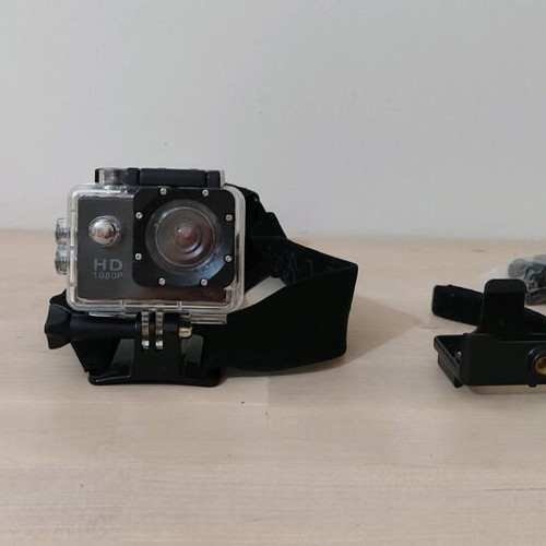 Action camera like new with waterproof case and mounting accessories