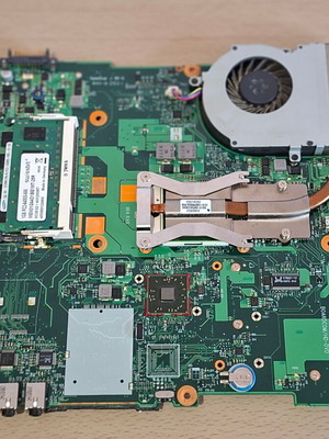 Toshiba Satellite L300 6050A2175001 MB A02 motherboard used with RAM, processor, and cooling
