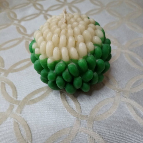 Green and ecru flower-shaped candle new