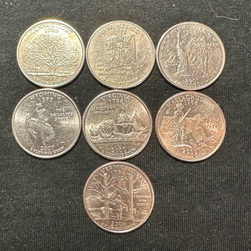 Lot of 7 used State Quarters of America