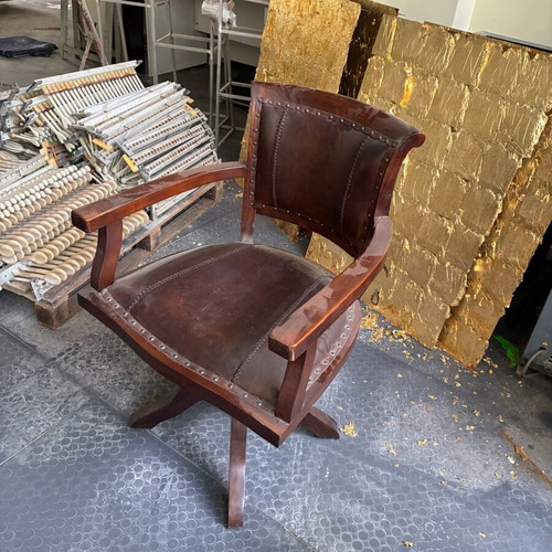 Wooden swivel office chair with leather upholstery