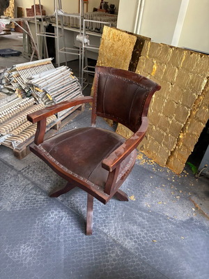Wooden swivel office chair with leather upholstery